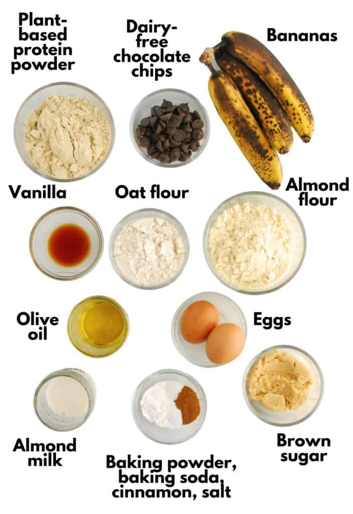 Bananas, chocolate chips, protein powder, vanilla, oat flour, almond flour, olive oil, eggs, almond milk, brown sugar, baking soda, baking powder, salt, and cinnamon.
