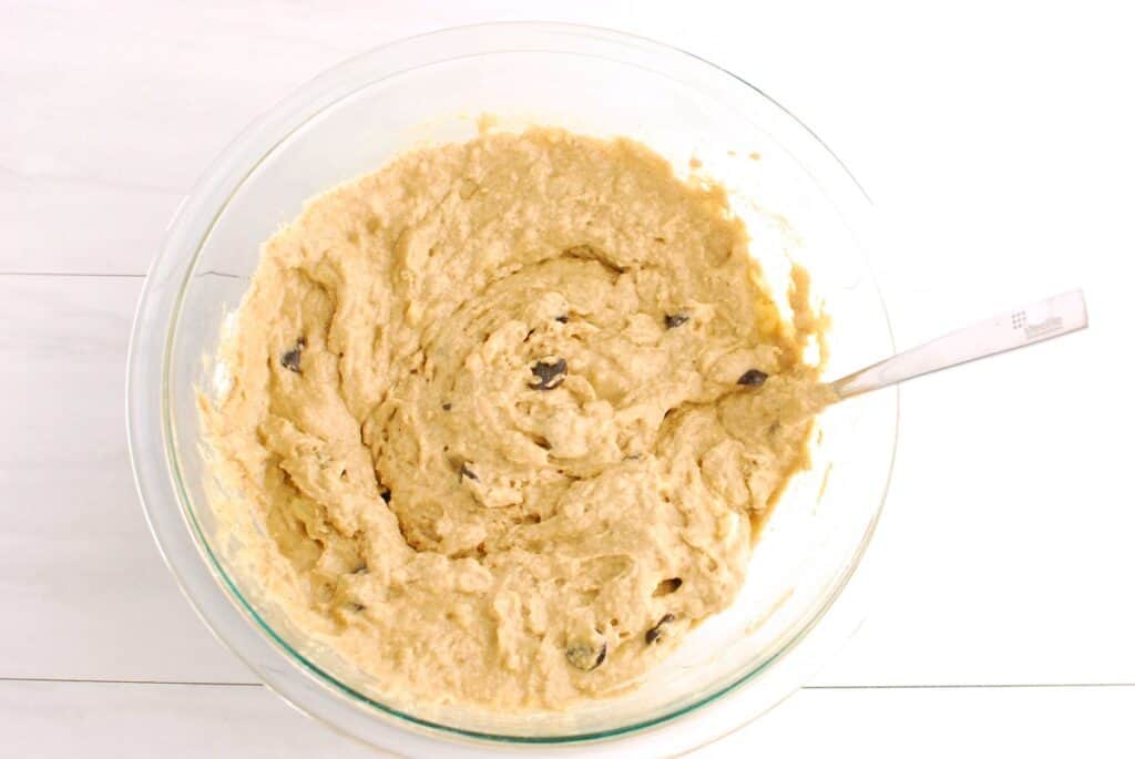 Muffin batter in a glass mixing bowl.