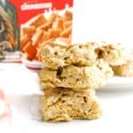 Several cinnamon life cereal treats stacked on top of each other.