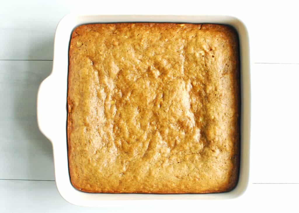 Just-baked banana cake in an 8x8 dish.
