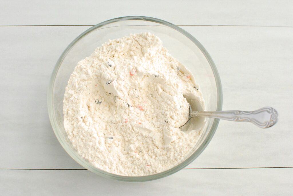 Flour, sprinkles, baking powder, baking soda, and salt mixed together.
