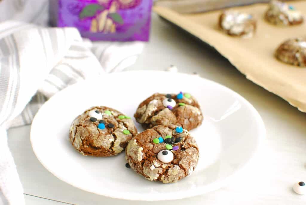 Three dairy free Halloween cookies on a small white plate.