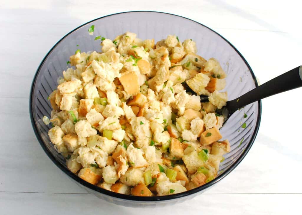 All the stuffing ingredients mixed together in a large mixing bowl.