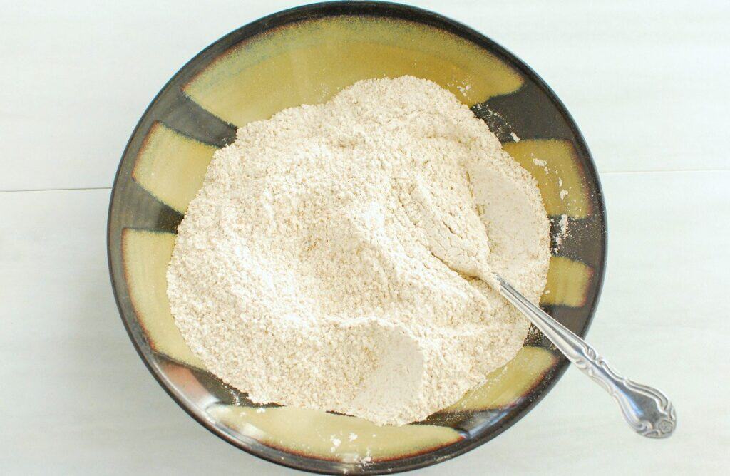Flour, baking soda, and salt mixed together in a small bowl.