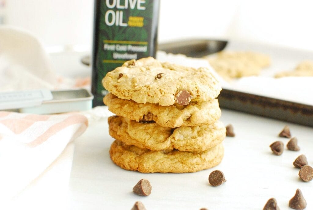 A stack of four olive oil chocolate chip cookies.