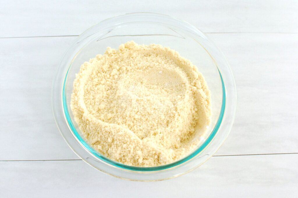 Almond flour, corn starch, baking soda, and salt mixed together in a small bowl.
