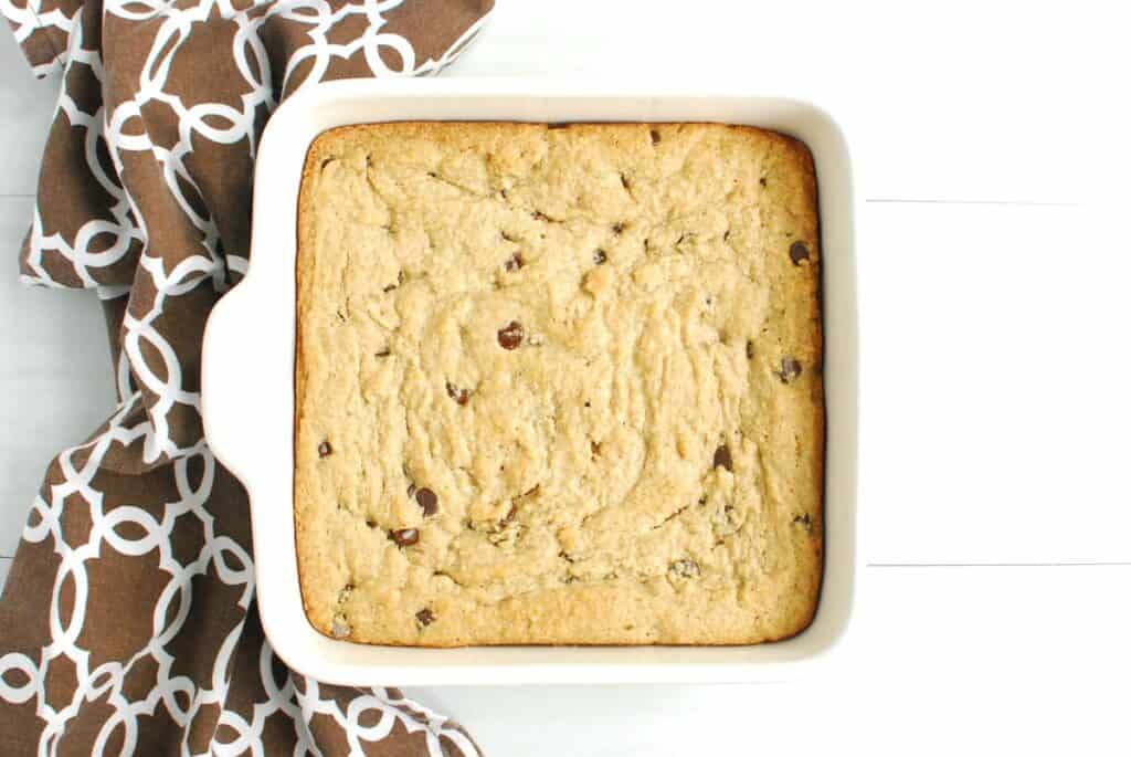 A baking dish with almond flour chocolate chip bars that were just baked.