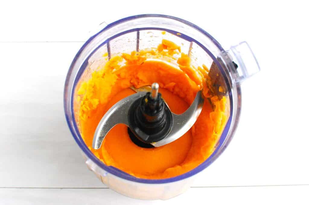 Pureed sweet potato in a mini food processor.