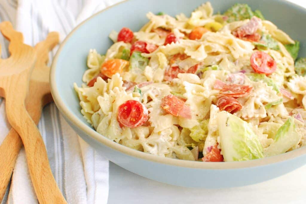 A close up of the Italian grinder pasta salad in a ceramic bowl.