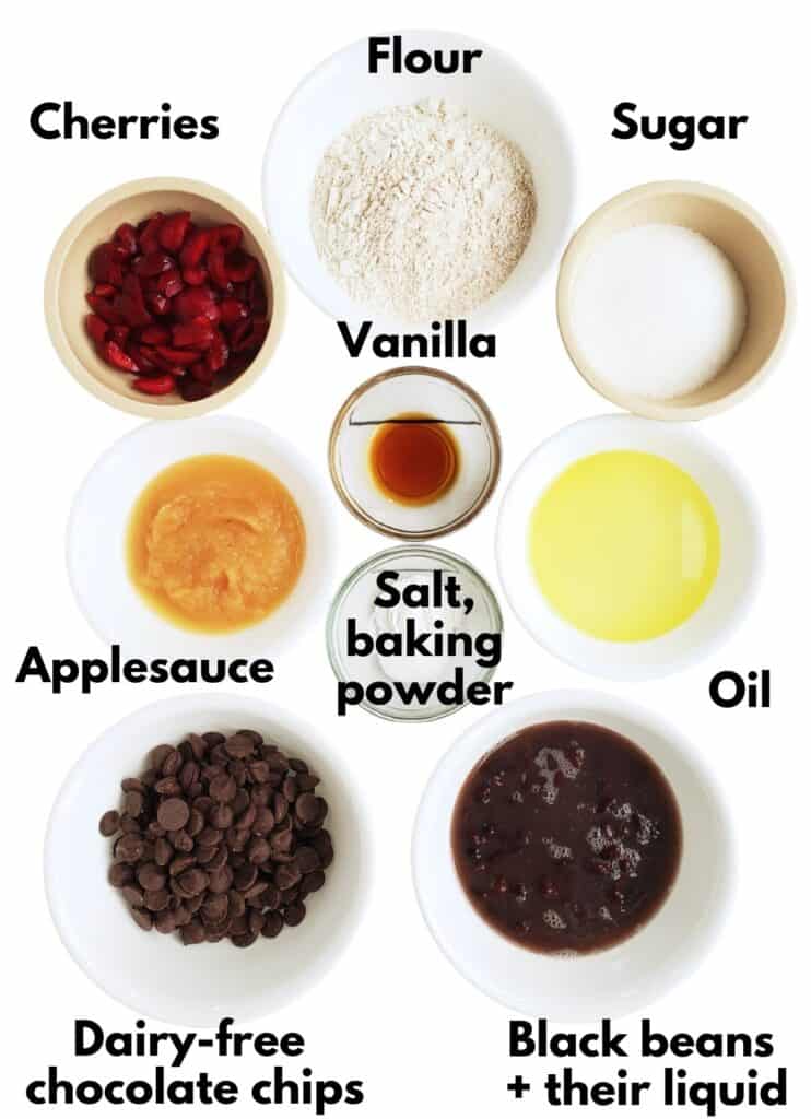 Flour, sugar, cherries, vanilla, salt, baking powder, oil, applesauce, black beans and their liquid, and dark chocolate chips.