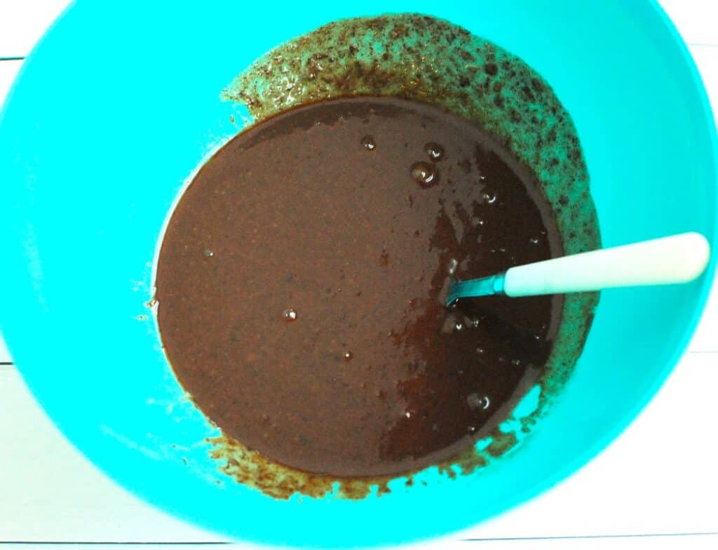 Melted chocolate added to the liquid ingredients.