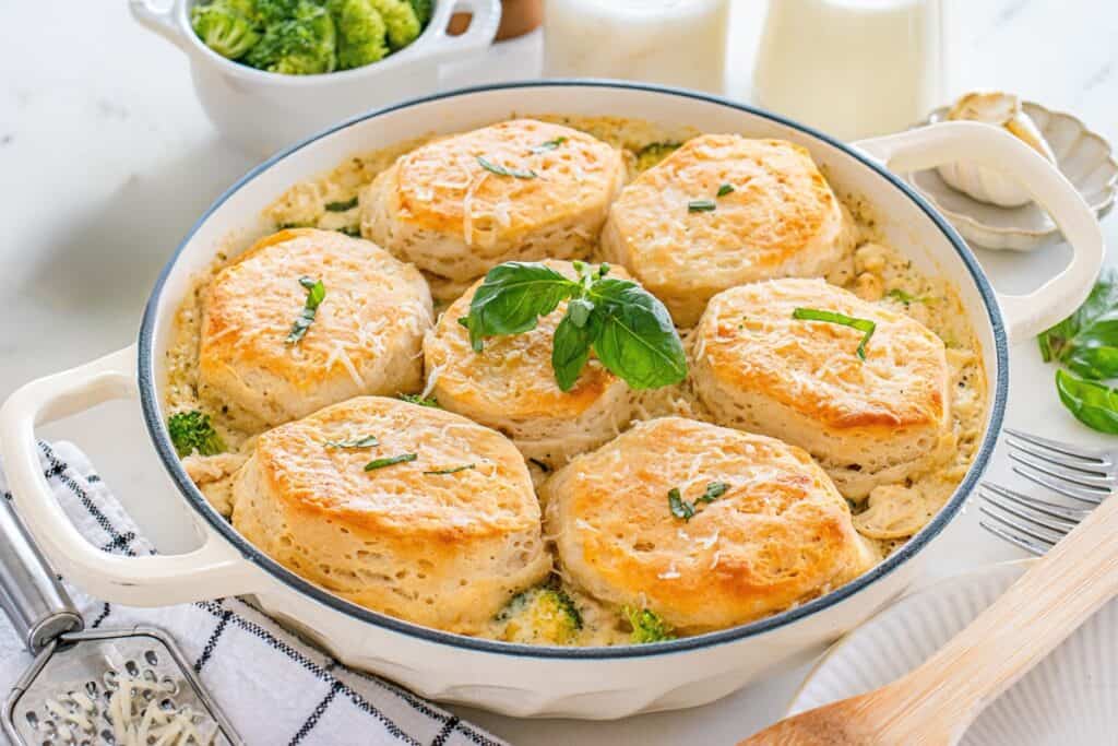 A skillet with just-baked dairy free chicken pot pie with biscuit topping.
