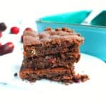 A stack of three dairy free cherry black bean brownies.