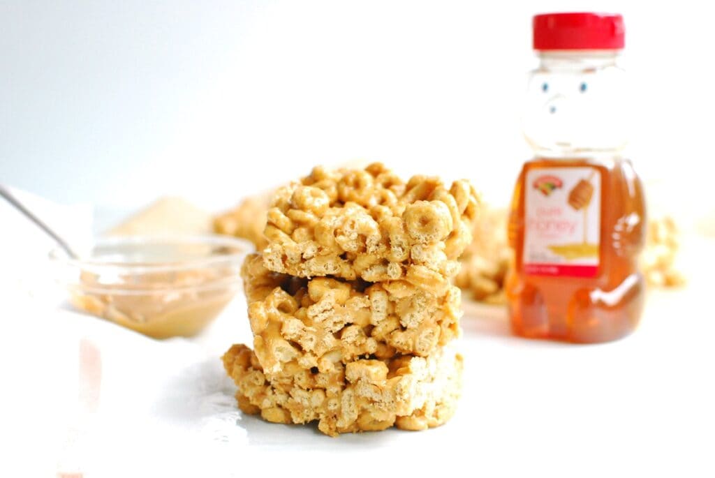 A stack of three peanut butter honey cheerios bars.
