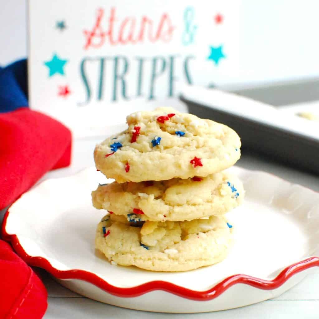 Coconut oil sugar cookies with sprinkles on a plate.