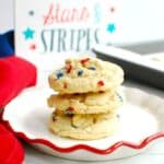 Coconut oil sugar cookies with sprinkles on a plate.