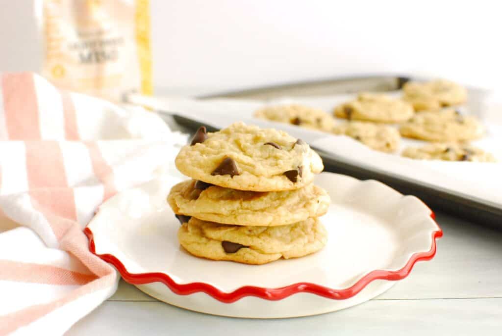 Three miso chocolate chip cookies stacked together on a plate.