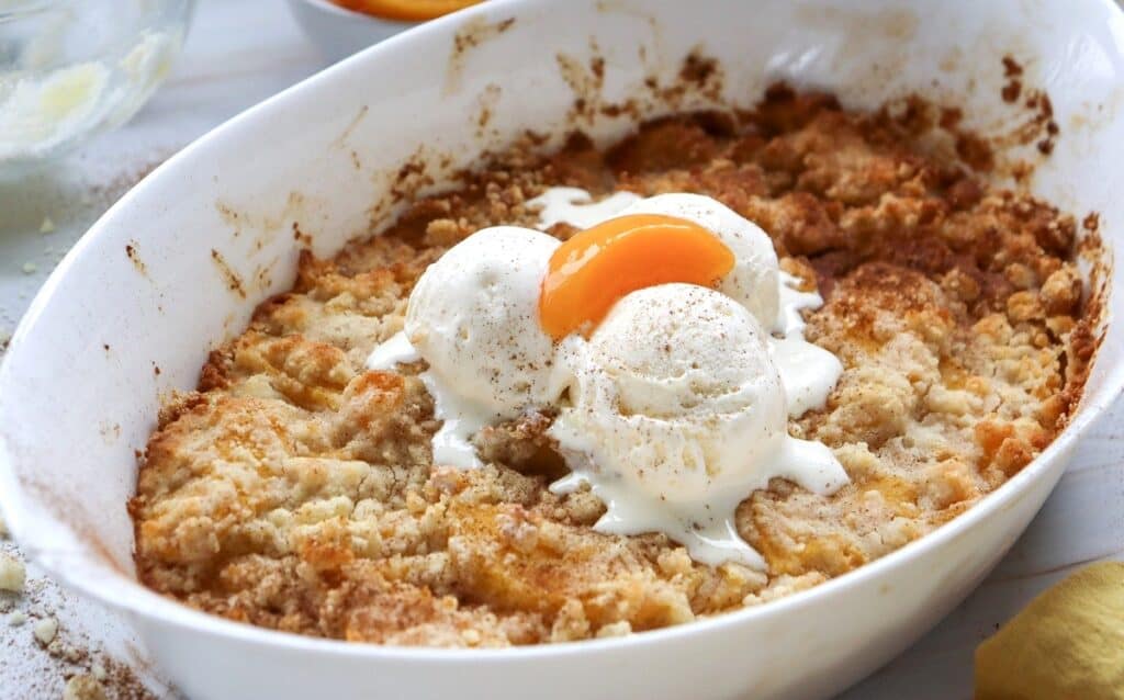 Dairy free peach cobbler in a baking dish.