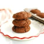 Three cake mix cookies stacked on top of each other.