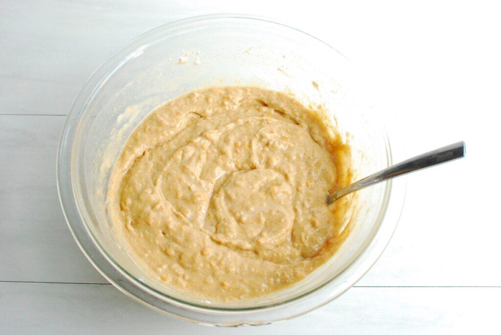 Pancake batter in a glass mixing bowl.