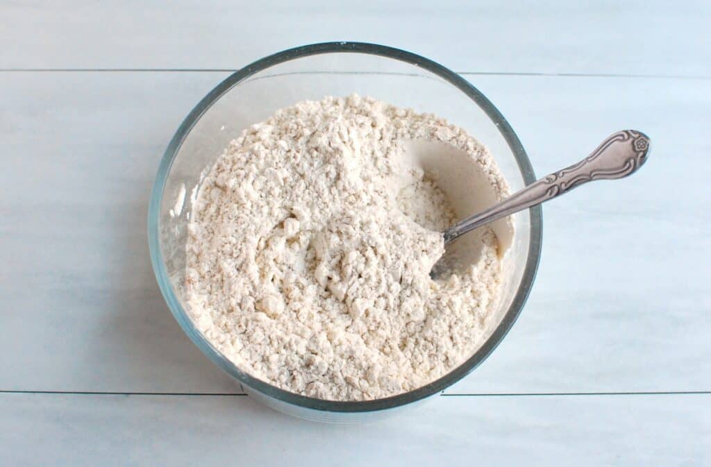 Flour, baking powder, baking soda, salt, and pumpkin pie spice mixed together.