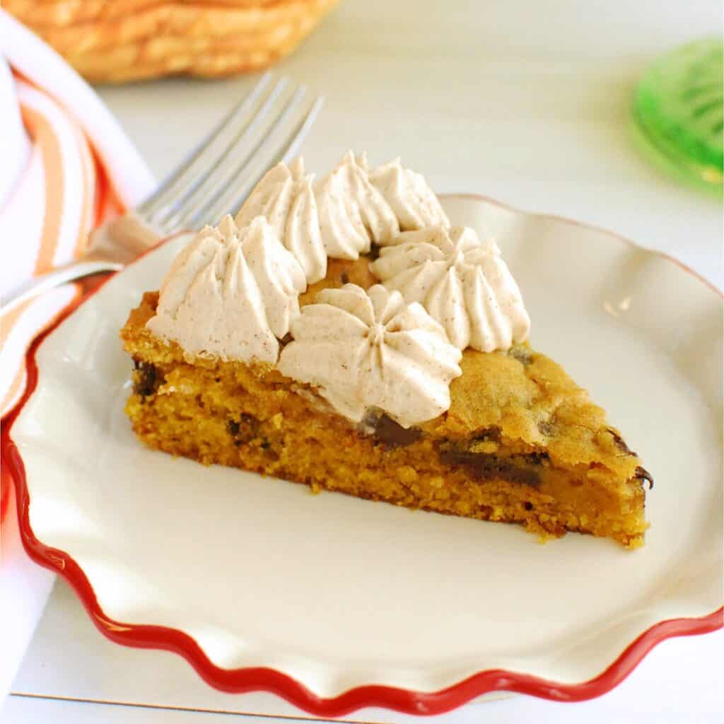 A slice of dairy free pumpkin cookie cake on a small plate.