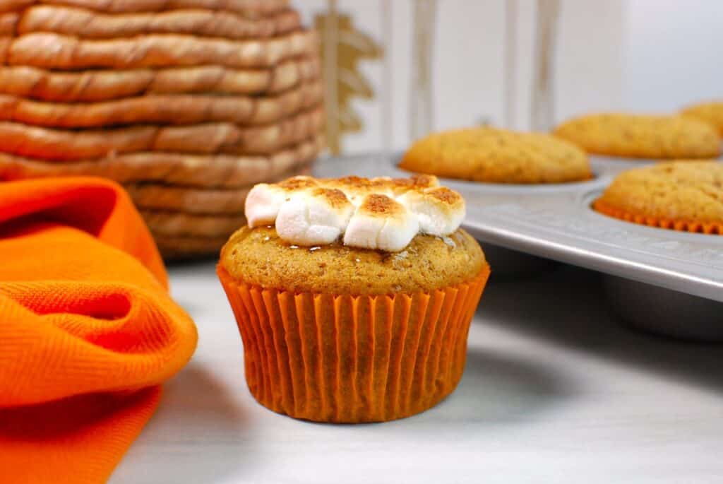 A sweet potato cupcakes topped with toasted marshmallows.